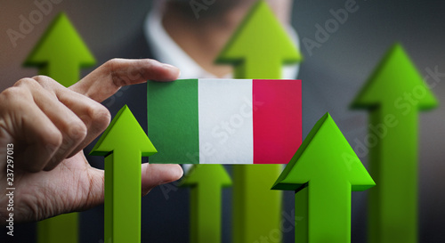 Nation Growth Concept, Green Up Arrows - Businessman Holding Card of Italy Flag