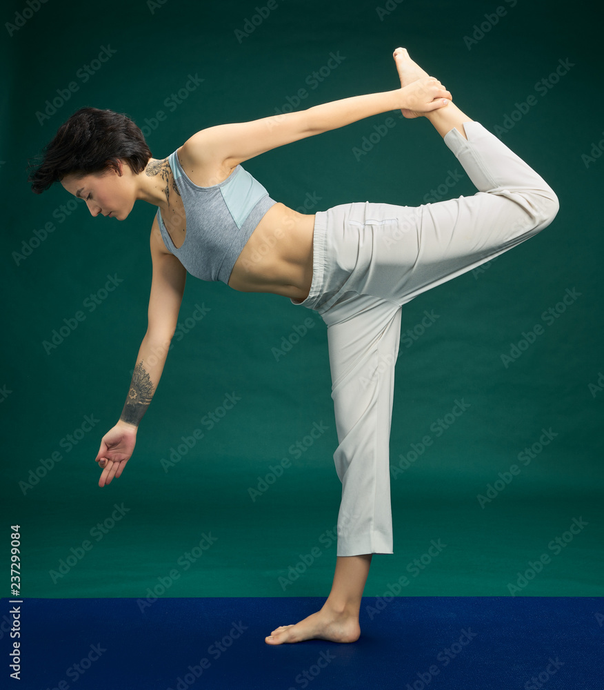 Pretty woman doing yoga exercise Pretty woman doing yoga exercise