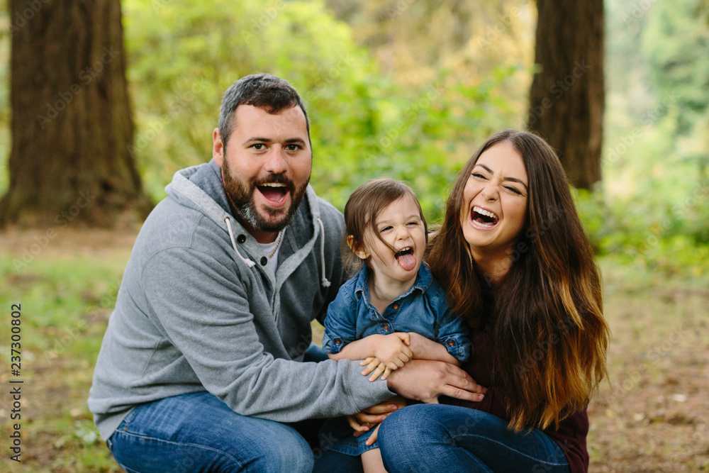 Portrait of Cute Family Laughing Loudly Portrait of Cute Family Laughing Loudly