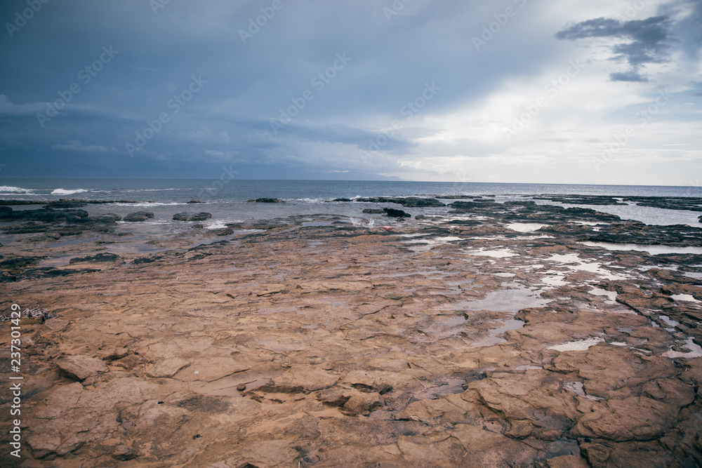 Sea and sand under a cloudy sky Sea and sand under a cloudy sky