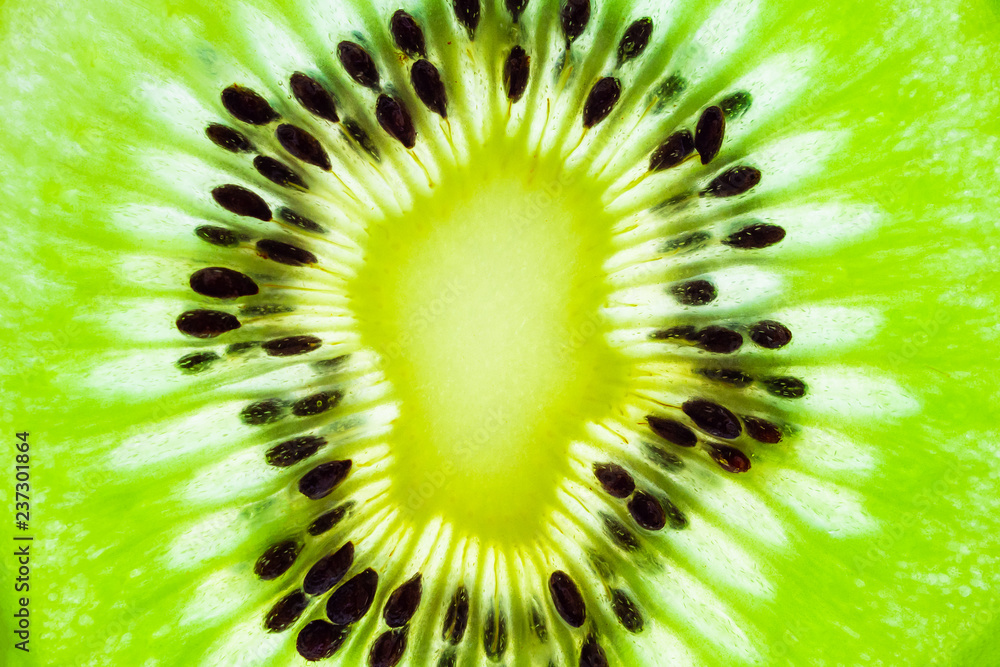Fresh kiwi fruit slices closeup macro texture background Fresh kiwi fruit slices closeup macro texture background