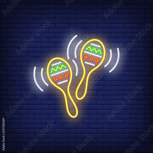 Pair of maracases neon sign. Mexican culture design. Night bright neon sign, colorful billboard, light banner. Vector illustration in neon style.