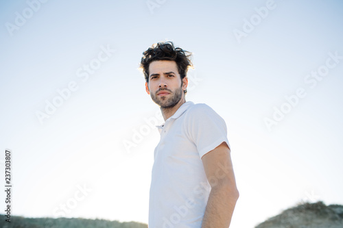 Displeased man in white T-shirt