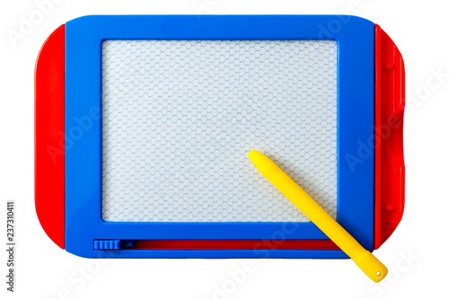 Kids educational toys concept with a blue and red toy magnetic drawing board or pad with a yellow stylus isolated on white background with copy space and a clip path cutout