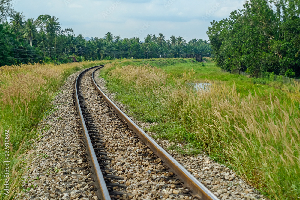 The railroad lines are round, filled with colorful trees looking over the railways as well as river bridges. The railroad lines are round, filled with colorful trees looking over the railways as well as river bridges.