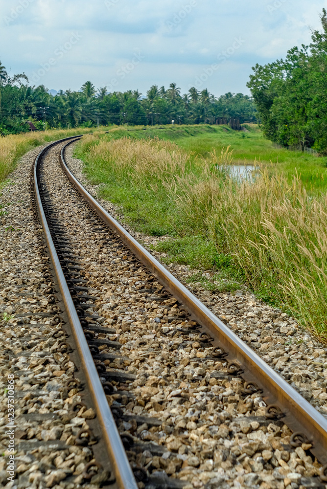 The railroad lines are round, filled with colorful trees looking over the railways as well as river bridges. The railroad lines are round, filled with colorful trees looking over the railways as well as river bridges.