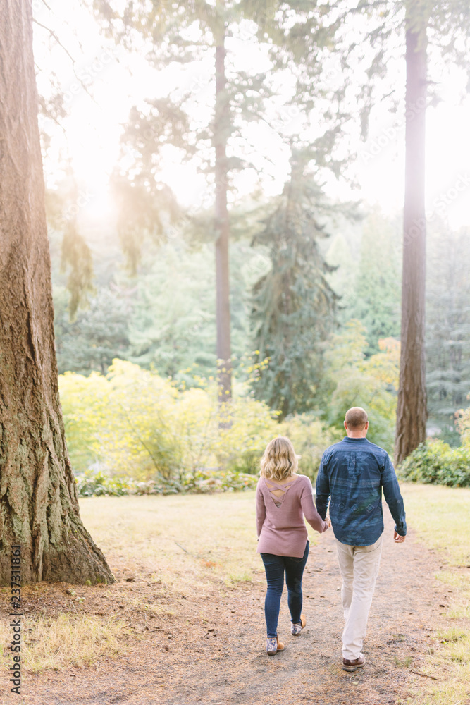 Couple Walking together on Forest Path Couple Walking together on Forest Path