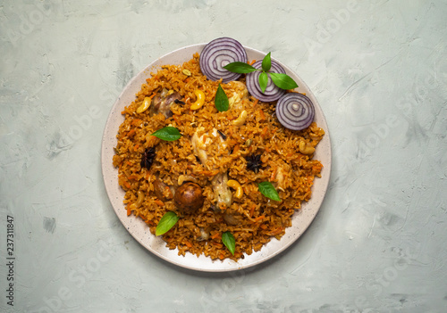 Homemade chicken Biryani. Arabic traditional food bowls kabsa with meat. Top view. 
