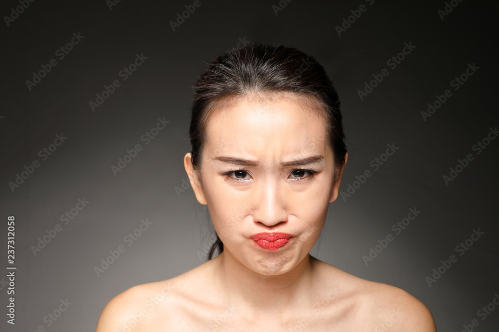 Young beautiful Asian woman facial expression