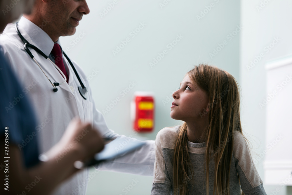 Exam: Nurse Keeping Records On Digital Tablet Exam: Nurse Keeping Records On Digital Tablet
