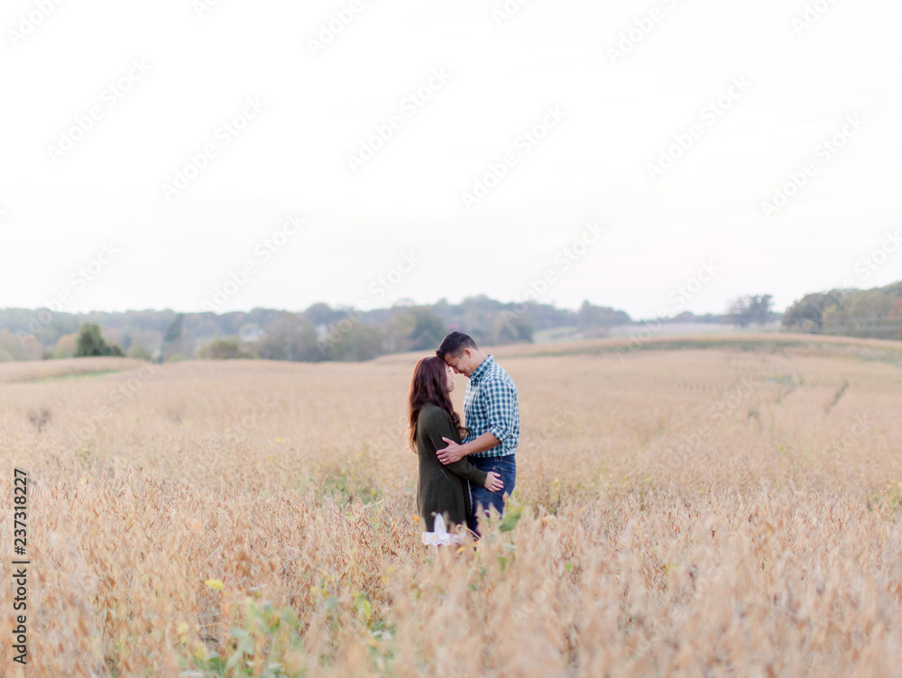 Couple Embracing in a vast field Couple Embracing in a vast field