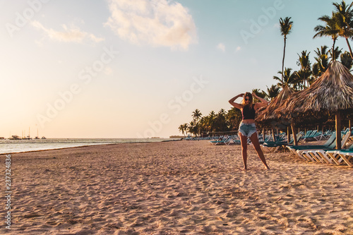 Fototapeta Naklejka Na Ścianę i Meble -  Girl at Bavaro Beaches in Punta Cana, Dominican Republic