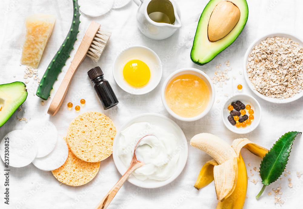Winter skin care. Homemade natural ingredients for a nourishing face mask on a light background, top view. Flat lay Winter skin care. Homemade natural ingredients for a nourishing face mask on a light background, top view. Flat lay