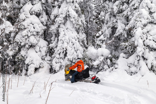 Athlete on a snowmobile.