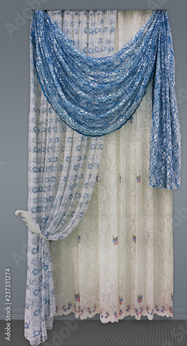 Curtains of the openwork fabric with a floral ornament,  the blue pelmet, and the tulle with embroidery photo