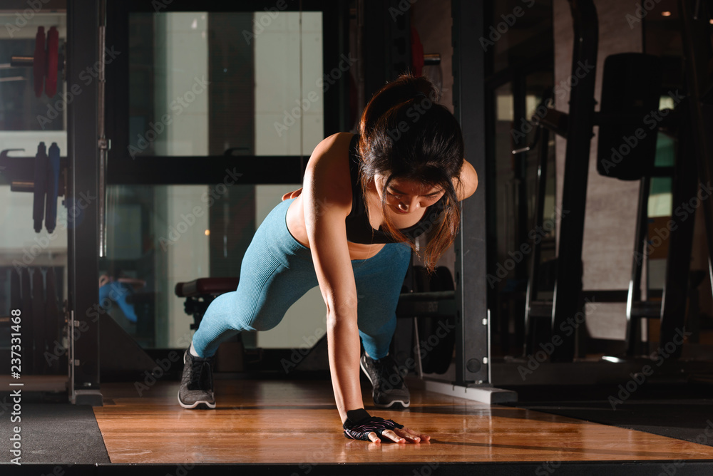 Young good looking woman push up with one hand challenging one self Young good looking woman push up with one hand challenging one self