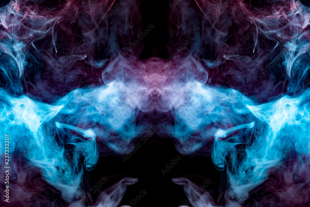 A multi-colored pattern of blue and pink smoke of a mystical shape in the form of a face and a ghost's head or a strange creature on a black isolated background. Abstract pattern in of waves and steam