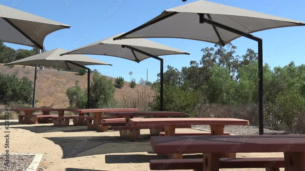 Picnic tables in an outdoor picnic area Picnic tables in an outdoor picnic area