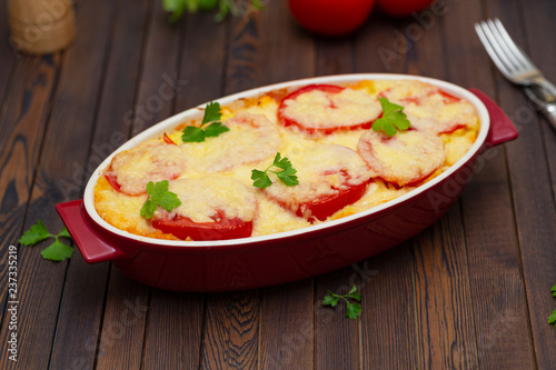 Potato casserole with meat, tomatoes and cheese