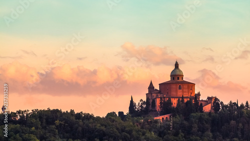 San Luca basilica church on Bologna hill, in a colorful twilight. orange and blue. in Italy photo
