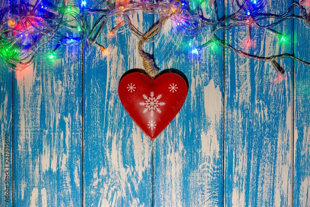 Christmas toys lie on a blue wooden background 