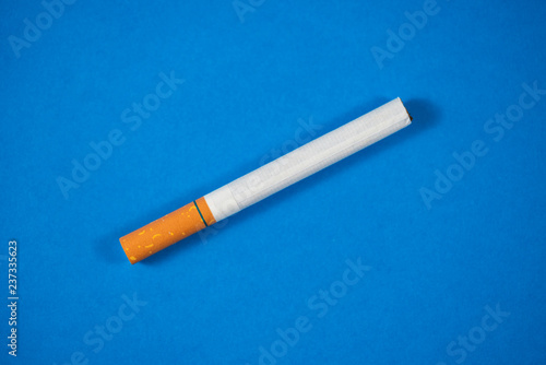 Tobacco Cigarette close up with blue background