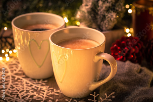 Two mugs of hot coffee for Christmas eve