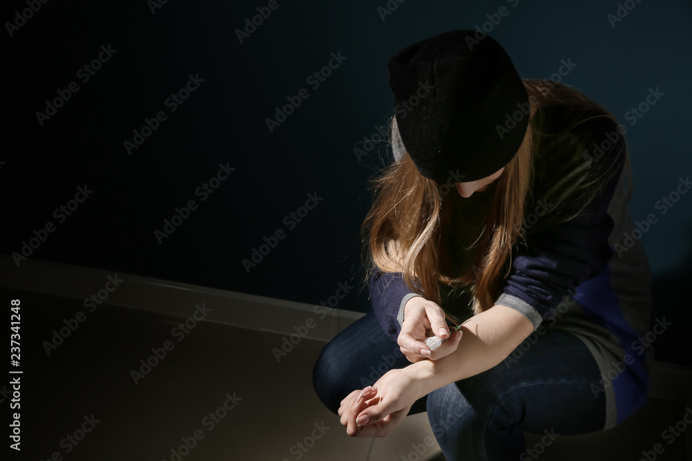 Female junkie with syringe near color wall. Concept of addiction Stock ...