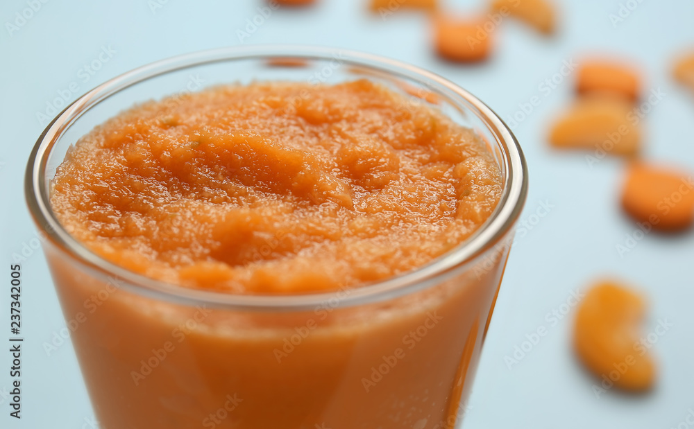 Glass of tasty orange smoothie, closeup Glass of tasty orange smoothie, closeup