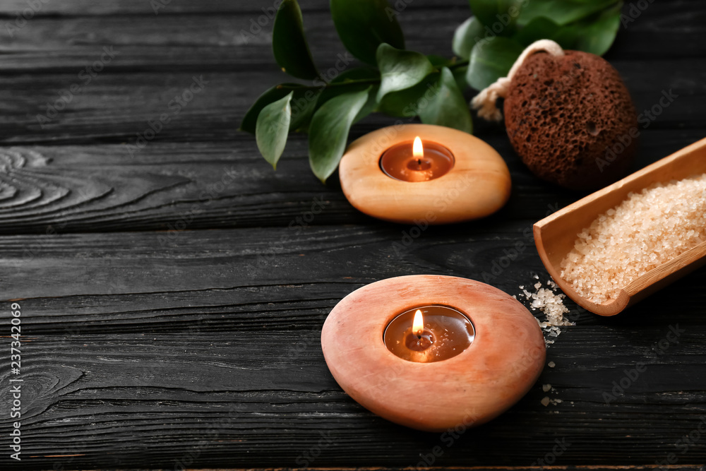 Fototapeta premium Beautiful spa composition with burning candles on dark wooden table