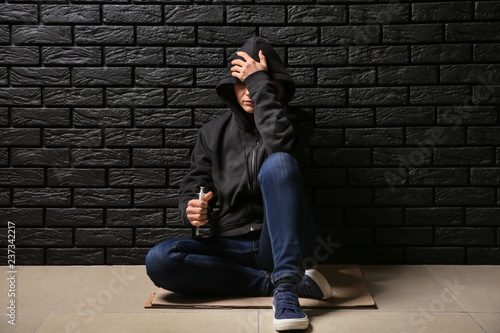 Female junkie with syringe ...