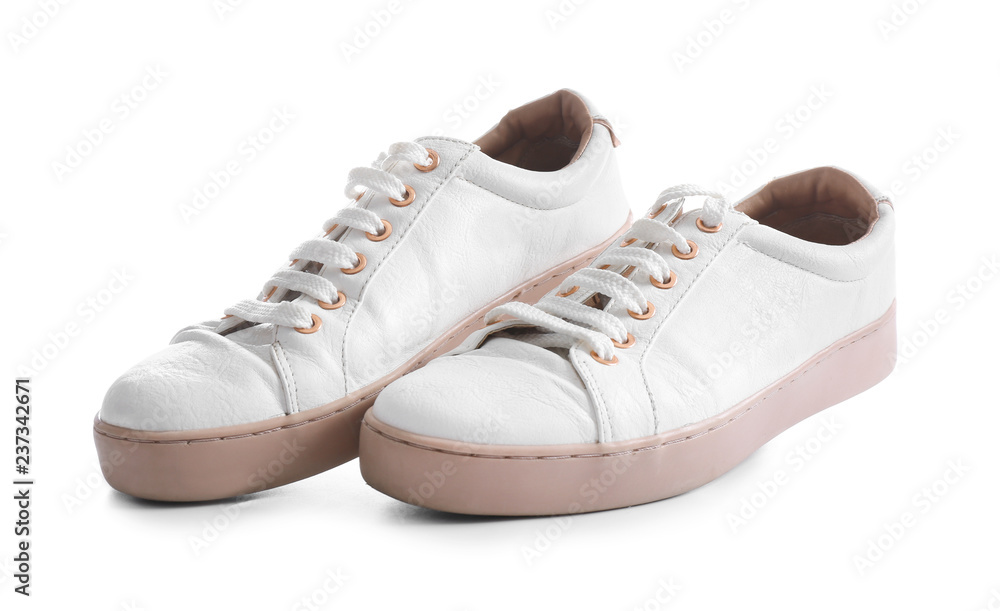 Pair of trendy sneakers on white background