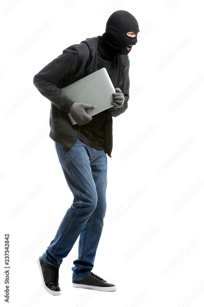 Male thief with laptop on white background