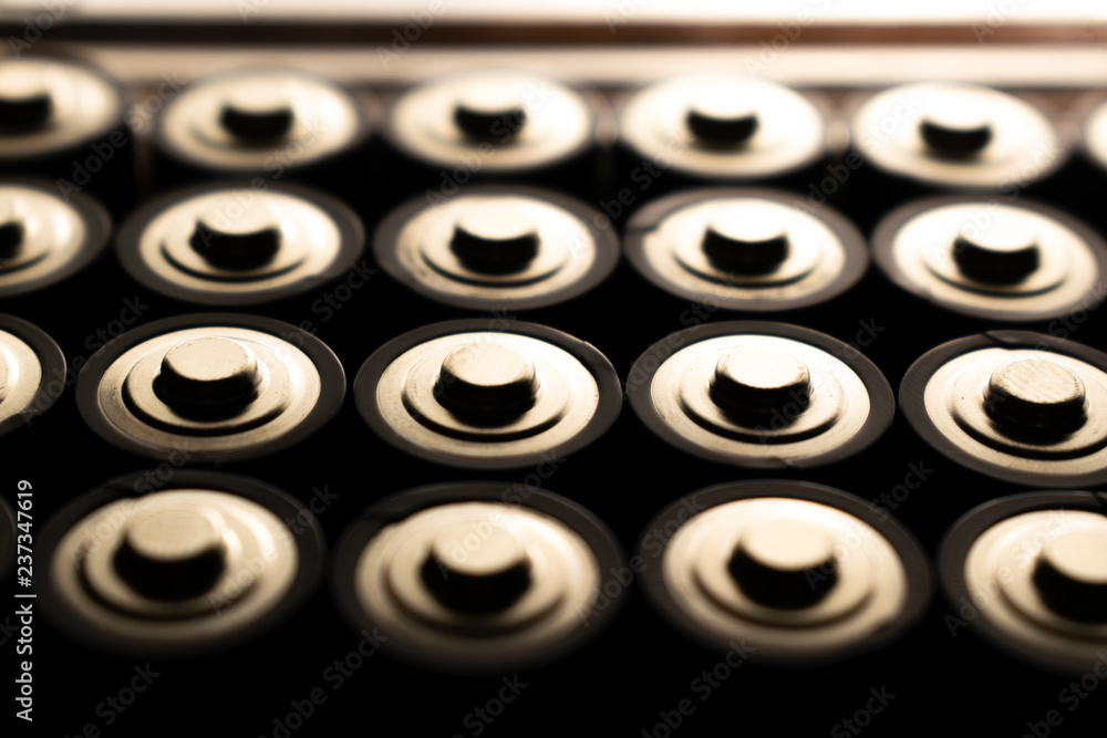 Closeup of pile of used alkaline batteries. Close up colorful rows of selection of AA batteries energy abstract background of colorful batteries. Closeup of pile of used alkaline batteries. Close up colorful rows of selection of AA batteries energy abstract background of colorful batteries.