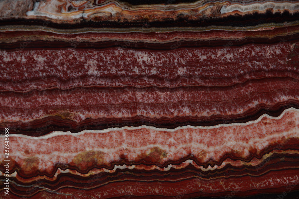 Natural red color Onyx stone with dark and light streaks and a beautiful pattern