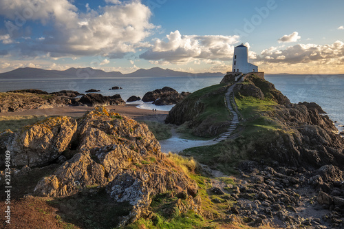 Lighthouse on Llanddwyn Island on the coast of Anglesey in north Wale, Uk. photo