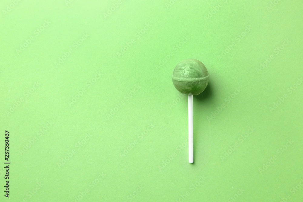 Tasty sweet lollipop on color background Tasty sweet lollipop on color background