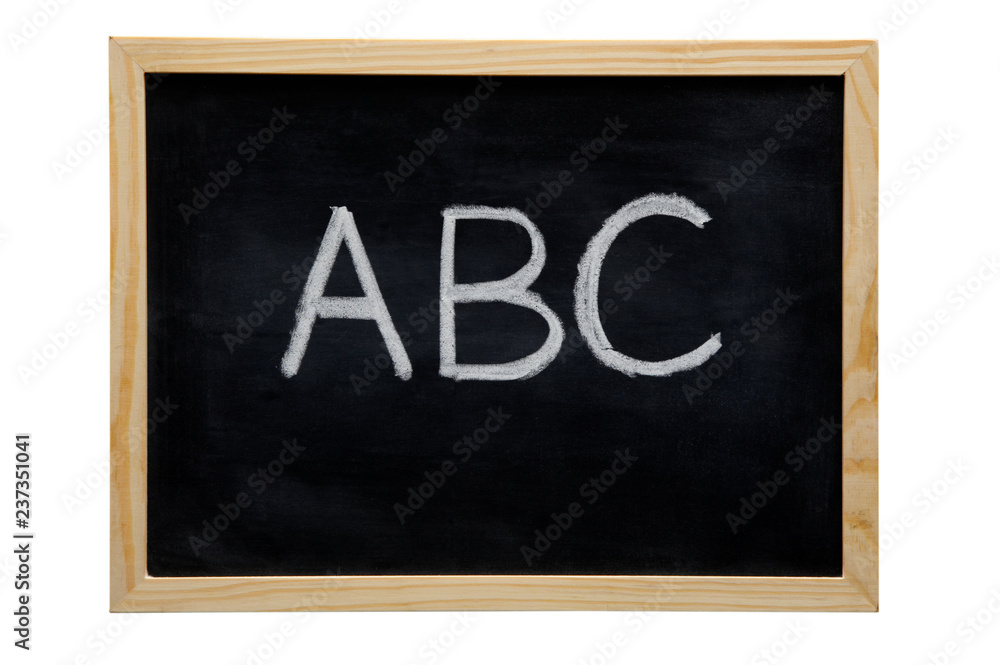Fototapeta premium WOODEN FRAMED BLACK BOARD WITH THE LETTERS A B C WRITTEN WITH WHITE CHALK
