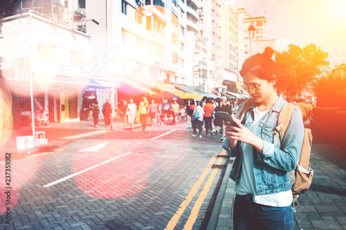 Photography Young woman traveling on Stanley Market in Hong Kong with bokeh light effect