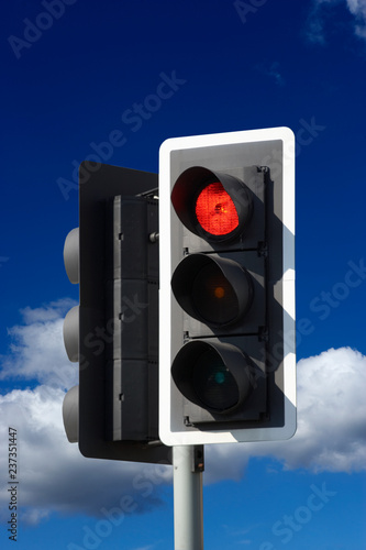 ROAD TRAFFIC LIGHT WITH BLUE SKY photo