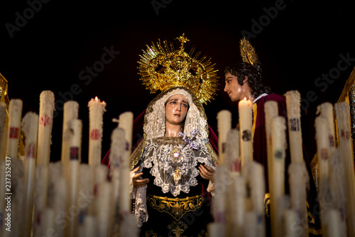 virgen con las velas encendidas en semana santa de Huelva y Andalucía  Sevilla photo