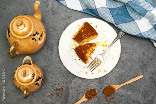Fototapeta arabic coffee with algerian homemade pound orange sliced cake on white plate and