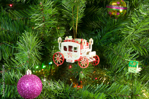 Wooden toy carriage on the Christmas tree