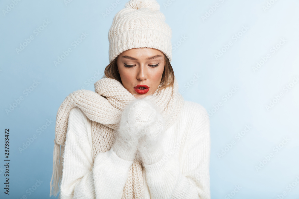Frozen young woman wearing sweater and hat Frozen young woman wearing sweater and hat
