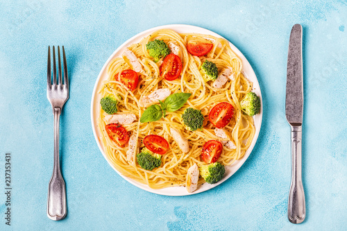 Plate of spaghetti tomato broccoli chicken