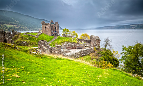 Photos Urquhart Castle with Dark Cloud Sky and Loch Ness in the Background