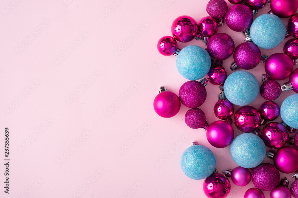 Minimal composition background of plastic pink and blue decorative Christmas balls. New Year concept. Minimal composition background of plastic pink and blue decorative Christmas balls. New Year concept.