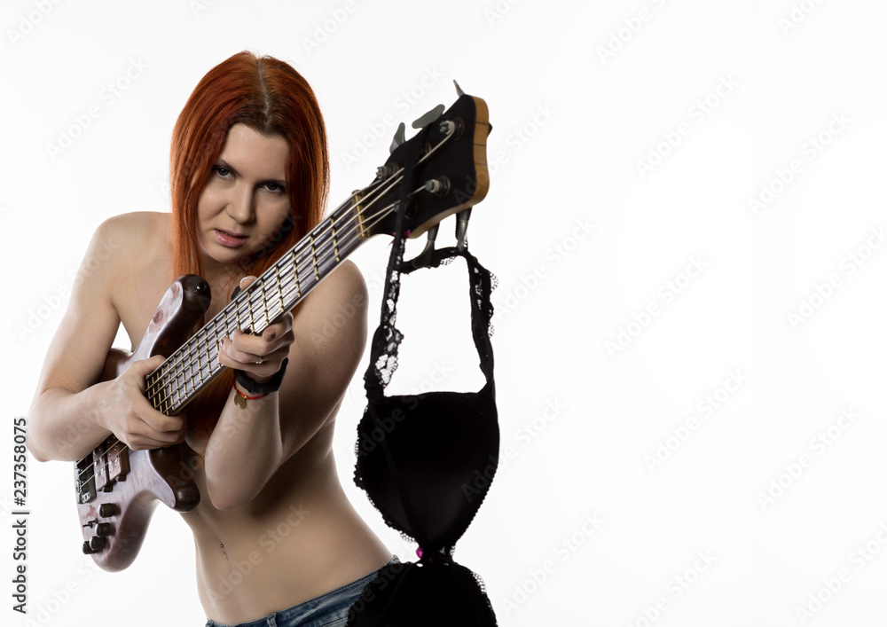 sexy nude rock woman playing on electric guitar on a white background