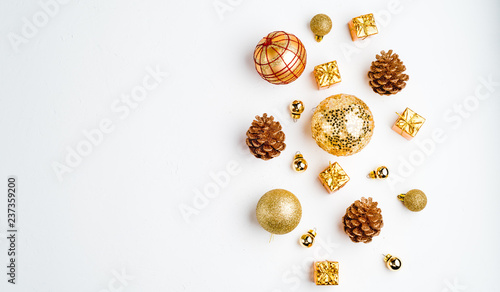 Christmas background. Flat Lay with Christmas golden deco baubles on white. Copy Space.