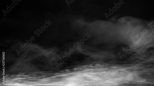 Realistic dry ice smoke floor. Clouds fog overlays perfect texture. Isolated misty on black background .